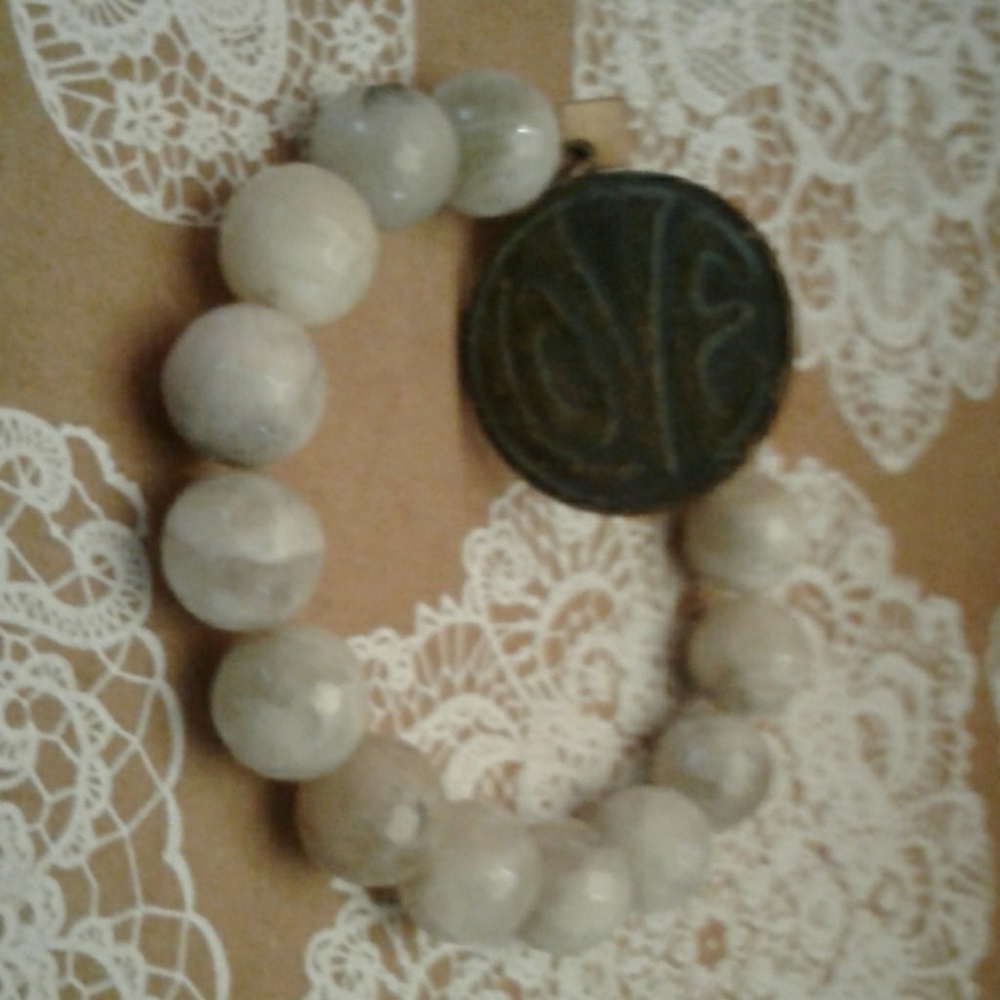 Stone bead bracelet with DB hangtag and charm